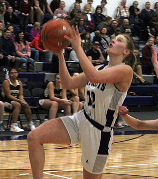 Julia Wassmuth goes for a lay-up against Timberline.