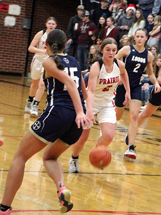 Lexi Schumacher handles the ball against Logos. She scored 33 points, her highest total of the season.