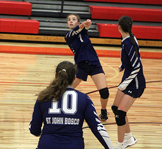 Annamae Cummings makes a pass at C.V. Also shown are Miah Mager and Catherine Beckman.
