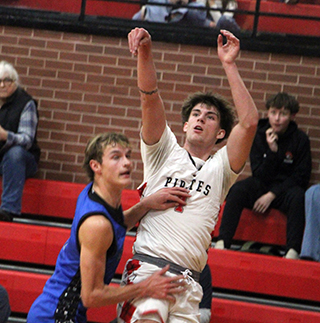 Riley Shears drains one of his 3 second quarter 3 pointers against Orofino. From the looks of things he probably should have shot a free throw a well.