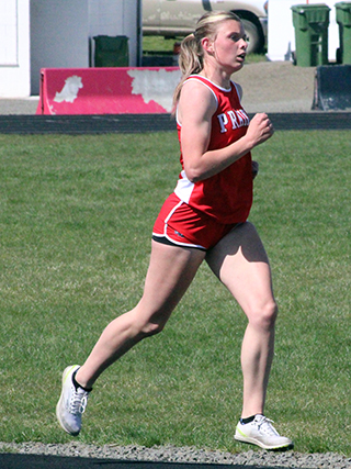 Sydney Shears won both the 3200 and 1600 at the Prairie Meet. She is shown in the 3200.